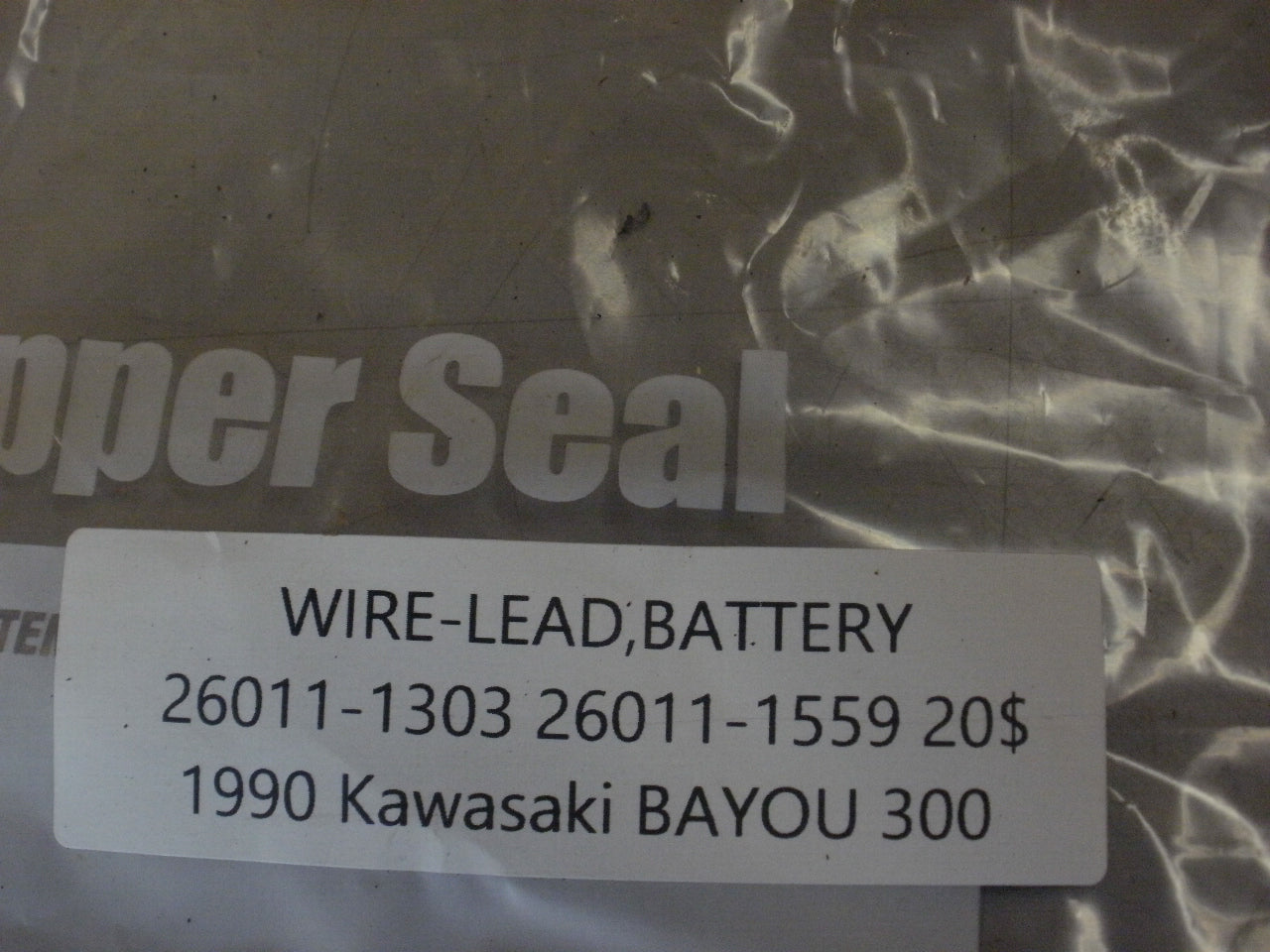 1990 KAWASAKI BAYOU 300 WIRE LEAD BATTERY 26011-1303 26011-1559