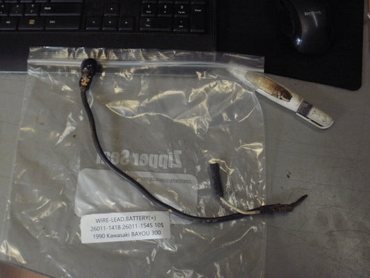 1990 KAWASAKI BAYOU 300 WIRE LEAD BATTERY (+) 26011-1418 26011-1545